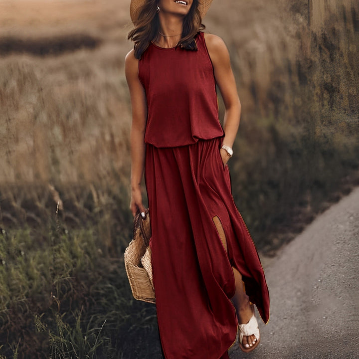 Elegancka i kolorowa sukienka maxi JONNA bez rękawów, w stylu retro, z lekkiego i zwiewnego materiału, zapewniająca wyrafinowany wygląd.
