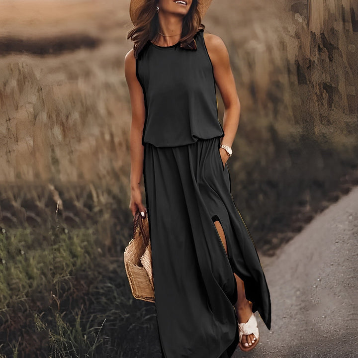 Elegancka i kolorowa sukienka maxi JONNA bez rękawów, w stylu retro, z lekkiego i zwiewnego materiału, zapewniająca wyrafinowany wygląd.