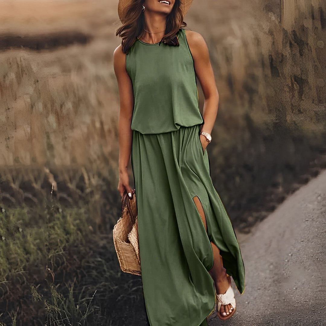 Elegancka i kolorowa sukienka maxi JONNA bez rękawów, w stylu retro, z lekkiego i zwiewnego materiału, zapewniająca wyrafinowany wygląd.