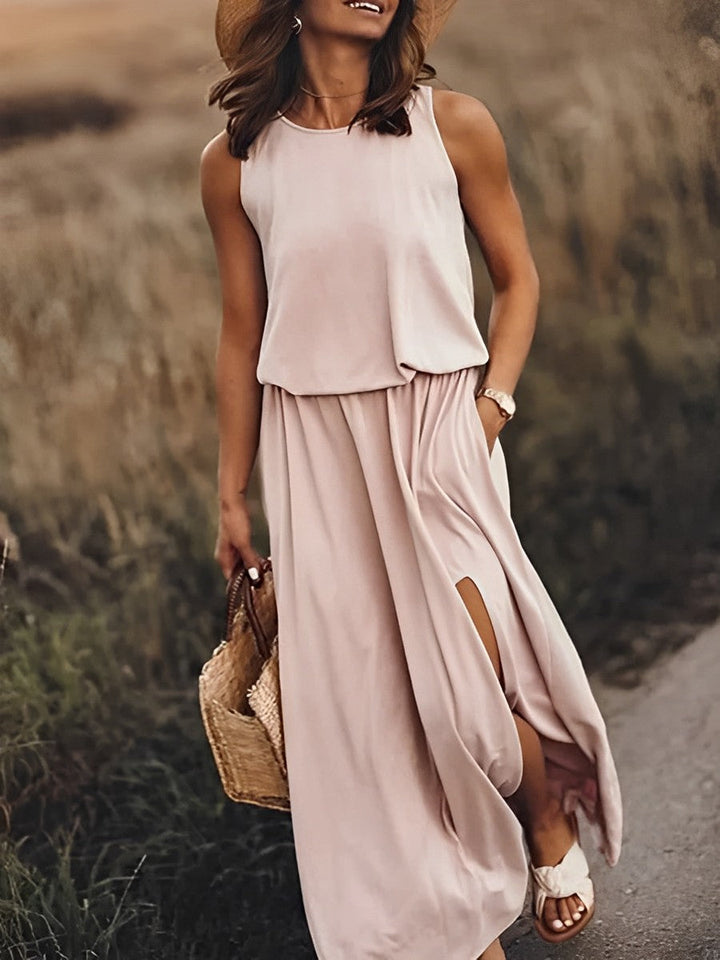 Elegancka i kolorowa sukienka maxi JONNA bez rękawów, w stylu retro, z lekkiego i zwiewnego materiału, zapewniająca wyrafinowany wygląd.