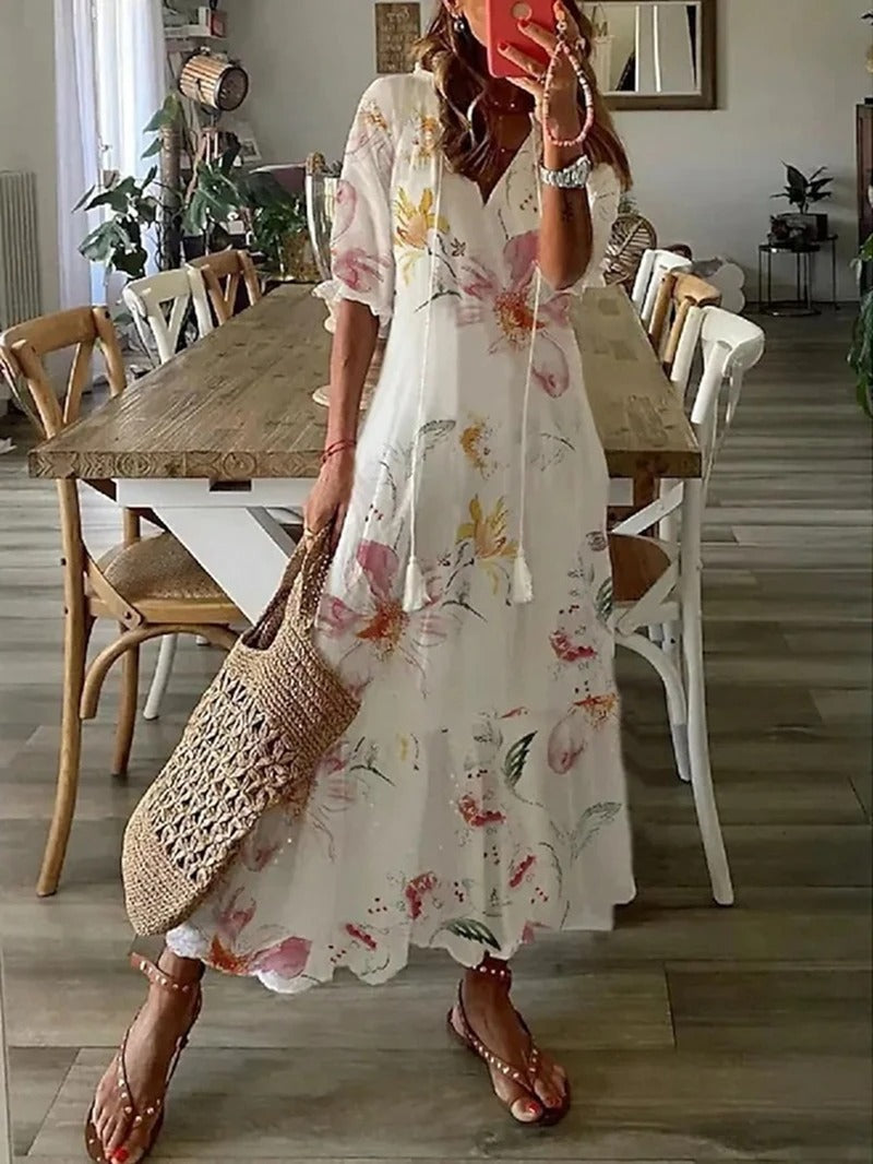 Zwiewna, zielona sukienka maxi boho z eleganckimi wzorami, szykowna i wygodna, długa do ziemi, z lekkiego materiału.