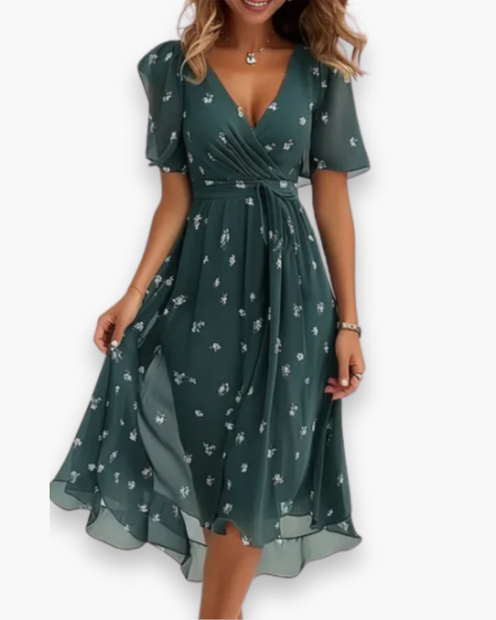 Damska elegancka rozkloszowana sukienka midi, dekolt w szpic, lekkie rękawy, zwiewny materiał, letnia elegancja.