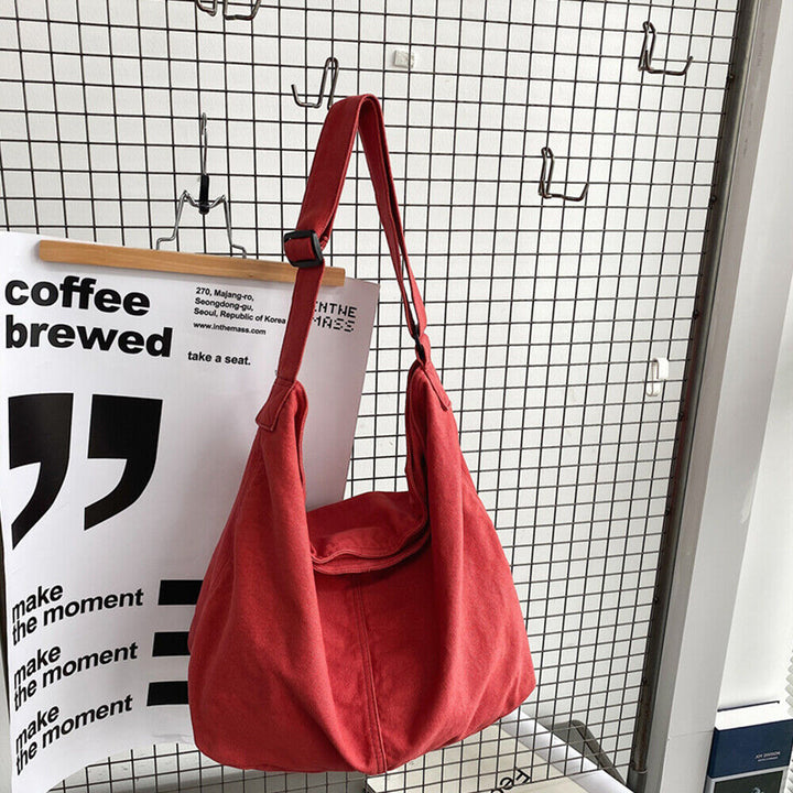 Pojemna torba na ramię z płótna, minimalistyczny design, regulowany pasek, idealna do pracy i na co dzień.