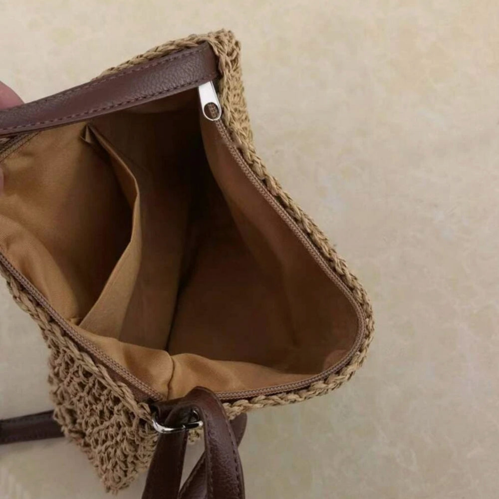 Damska torba na ramię Léandre w kolorze beżowym z detalami ze skóry wegańskiej i regulowanym paskiem.