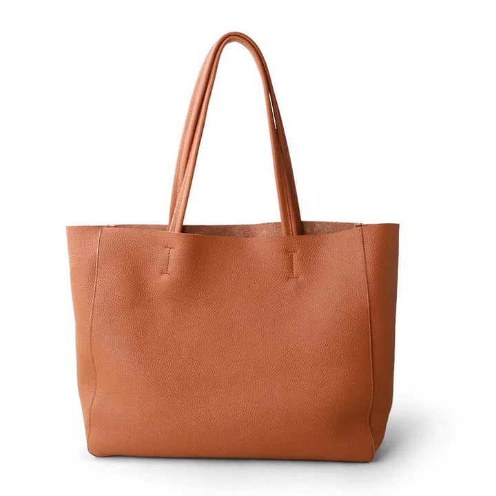 Czarna shopperka ze skóry naturalnej, elegancka i przestronna, dodatek dla nowoczesnej kobiety.