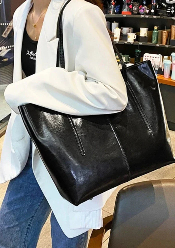 Brązowa damska torba na laptopa z prawdziwej skóry, nowoczesna, wytrzymała i elegancka, idealna do pracy lub na studia.