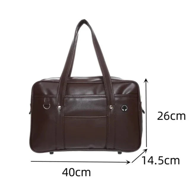 Stylowa torba tote dla uczennic, czarna skóra PU, przestronna, z przegrodą na laptopa i praktycznymi kieszeniami.