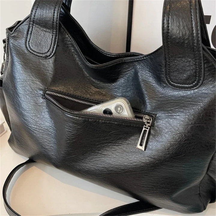 Torba damska na ramię ze skóry wegańskiej, o eleganckim designie, w klasycznym kolorze, idealna dla nowoczesnych kobiet.