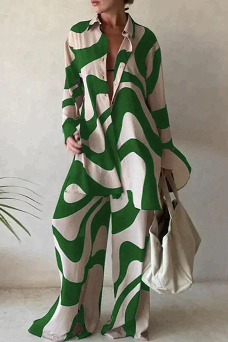 Damski garnitur spodnie z eleganckim geometrycznym wzorem, luźny krój, bluzka z długimi rękawami dla nowoczesnego stylu.