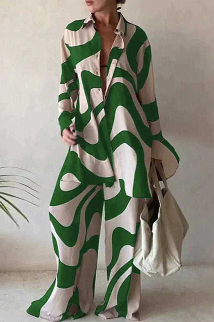 Damski garnitur spodnie z eleganckim geometrycznym wzorem, luźny krój, bluzka z długimi rękawami dla nowoczesnego stylu.