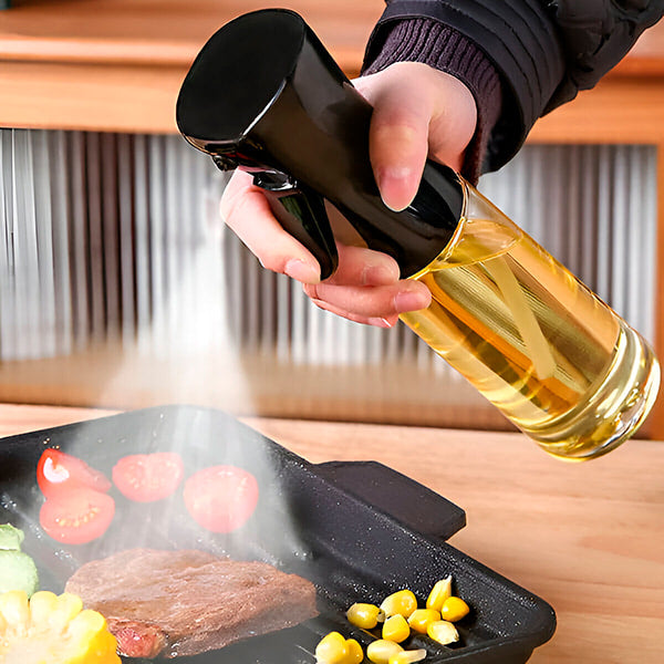 Vaporisateur de cuisine universel élégant et ergonomique en acier inoxydable pour une cuisson précise avec contrôle total.