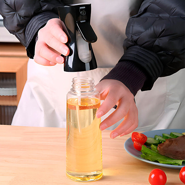 Vaporisateur de cuisine universel élégant et ergonomique en acier inoxydable pour une cuisson précise avec contrôle total.